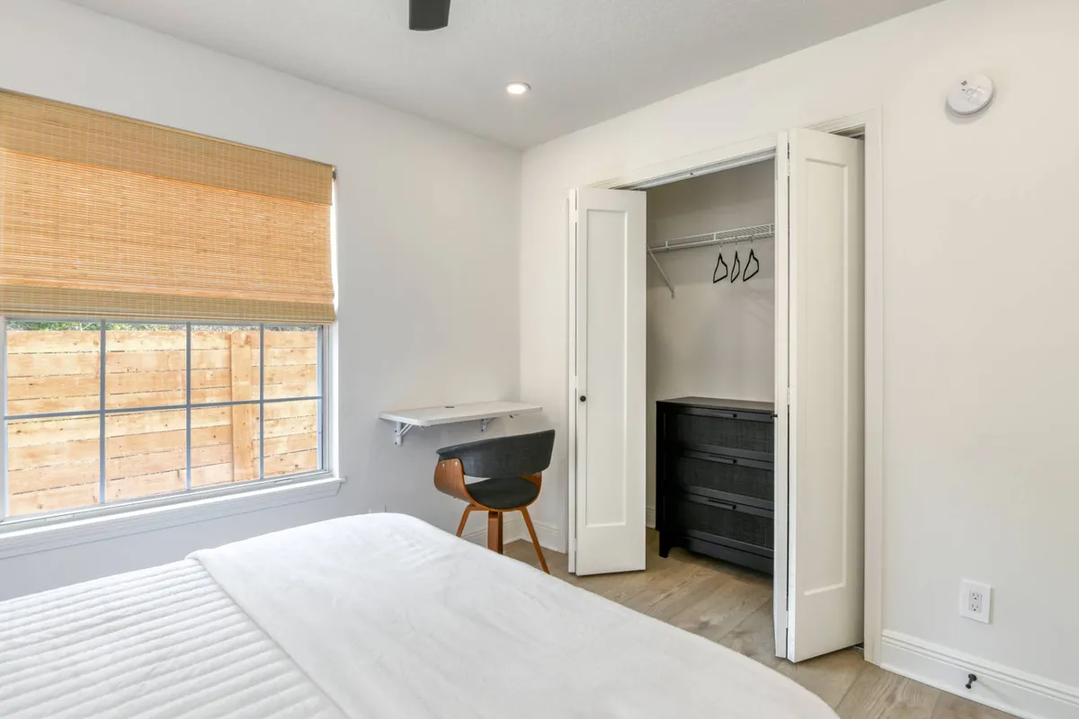 Bedroom with closet and desk nook