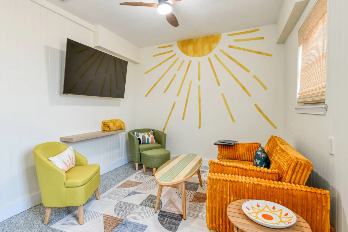 Bonus room lounge with sunburst mural