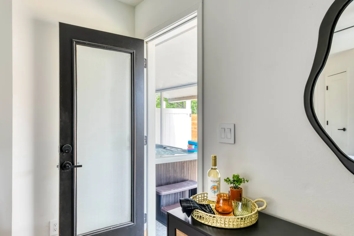 Entry with coastal mirror and bar cart