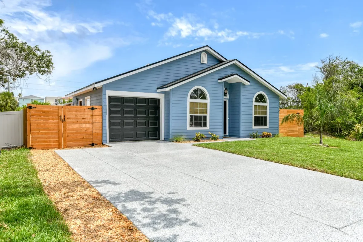 Exterior with garage and wide driveway