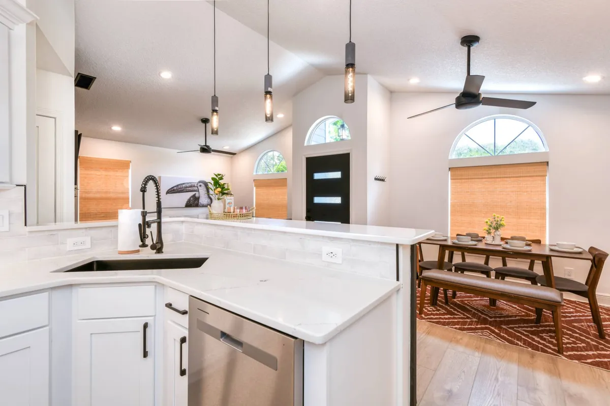 Kitchen island with farmhouse sink and dining bench