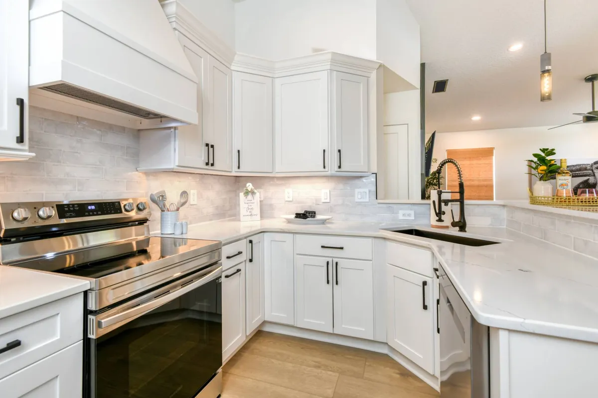 Fully equipped kitchen with electric range
