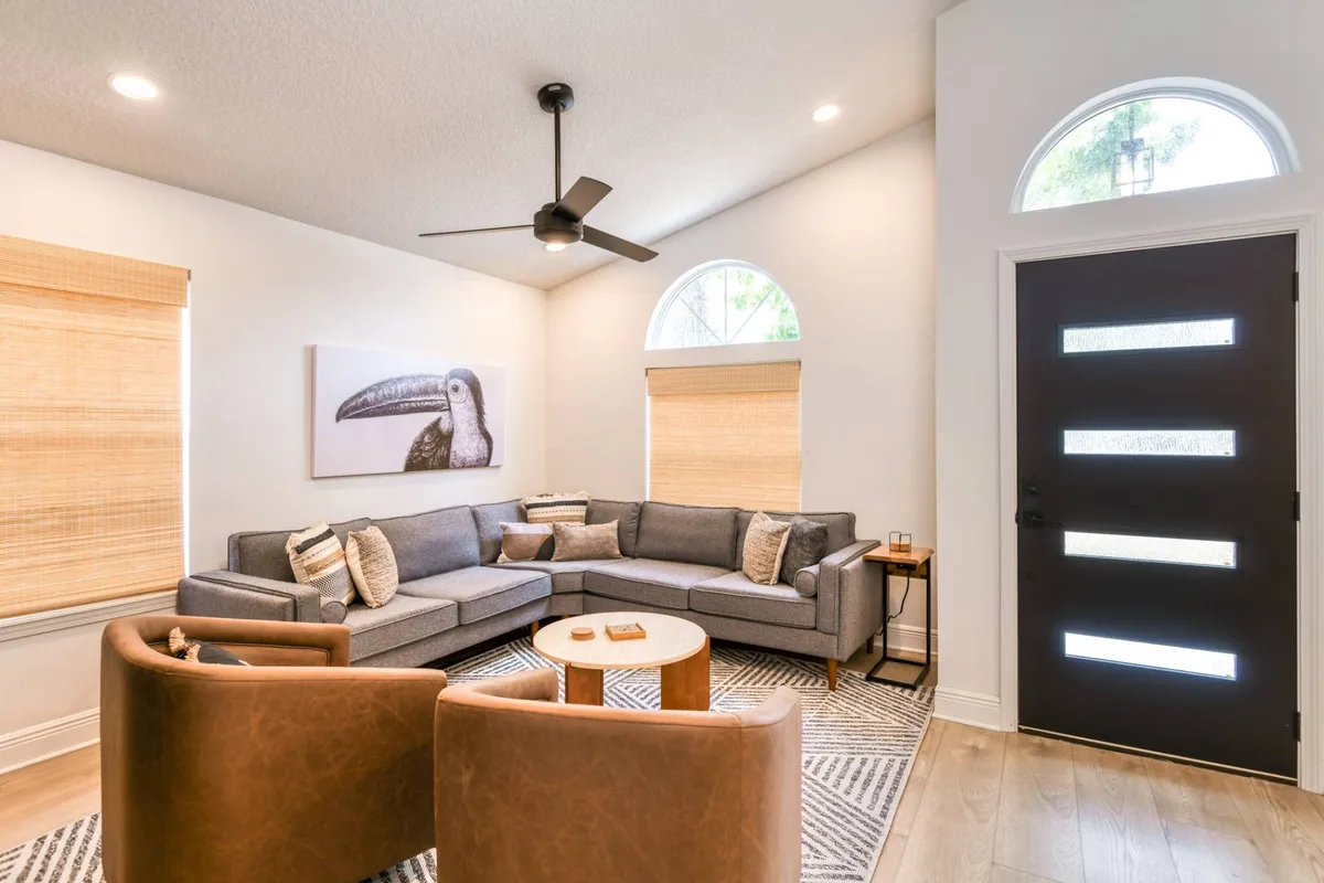 Living room with gray sectional at Madison By The Sea, a pet-friendly Anastasia Island vacation rental