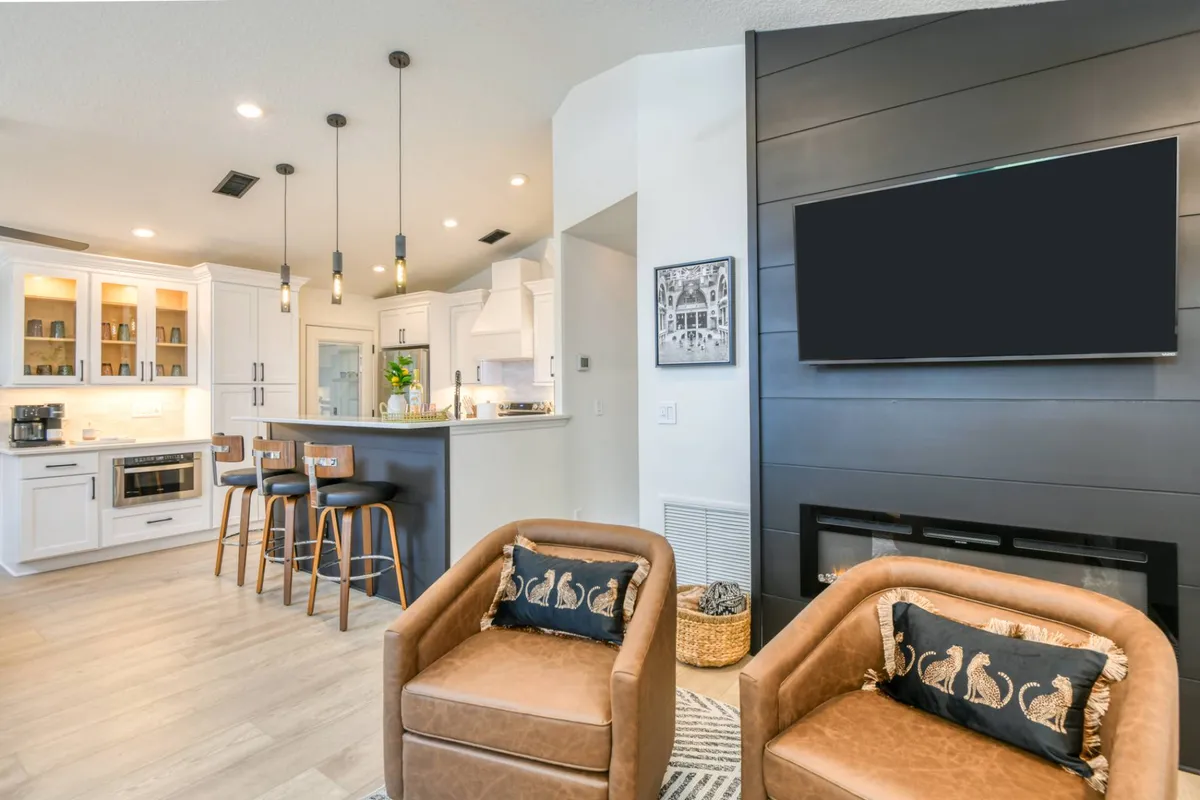 Open-concept kitchen, bar seating and living room