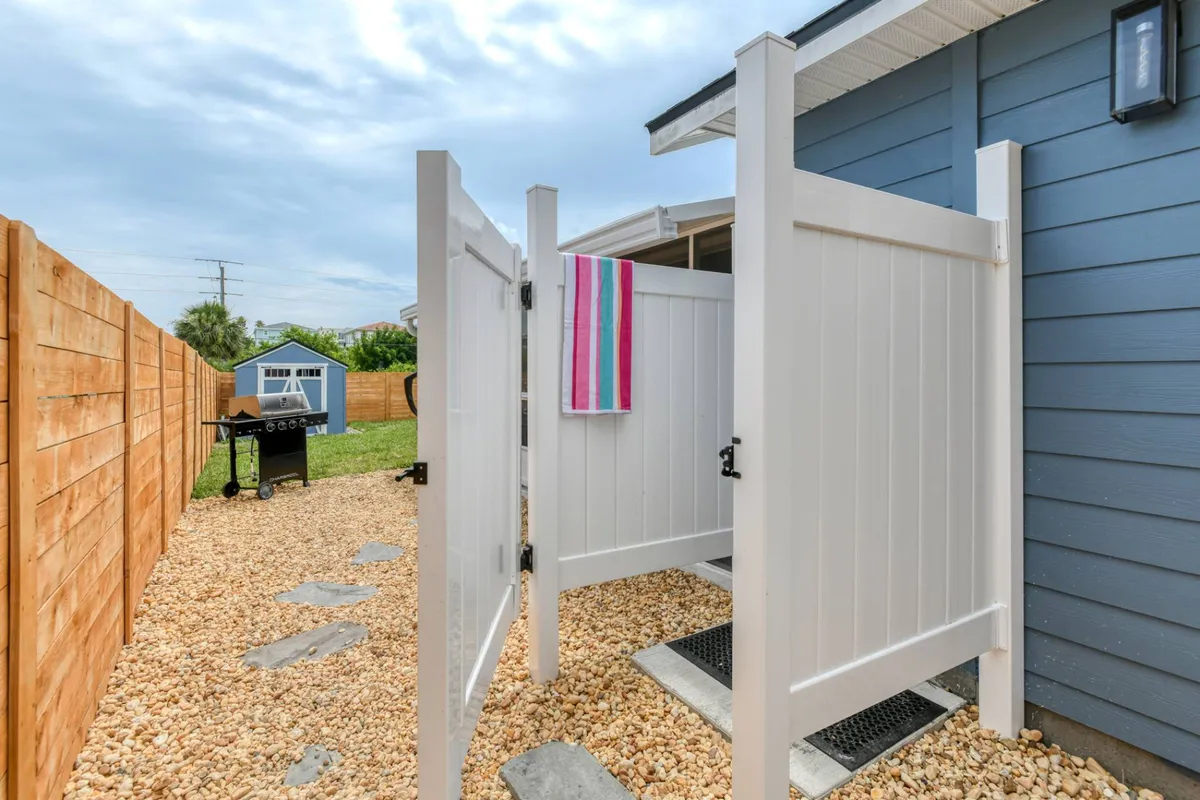 Outdoor shower beside the fence